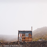 Buy canvas prints of Small wooden hut on top of a mountain surrounded by fog in winter to seek solitude. by Joaquin Corbalan