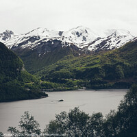 Buy canvas prints of Lake surrounded by high snowy mountains in winter. by Joaquin Corbalan