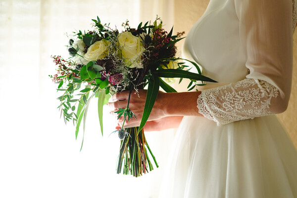 Bride holding her wedding bouquet Picture Board by Joaquin Corbalan