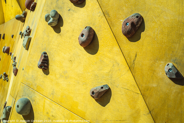 Detail of the wall of an outdoor climbing wall to practice climbing Picture Board by Joaquin Corbalan