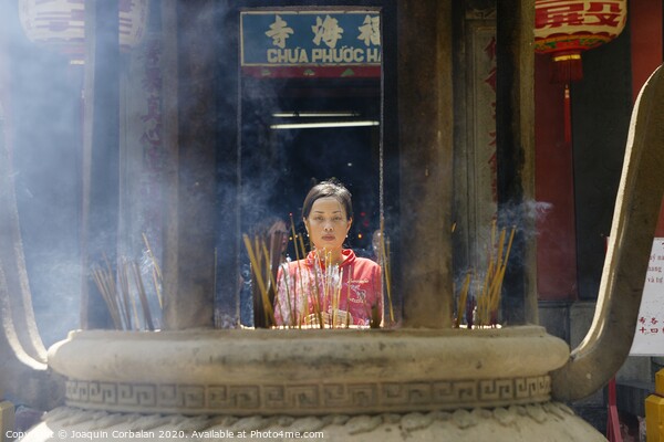 Ho Chi Ming, Vietnam - 27 October 2011: Asian religious people praying in Vietnam temple Picture Board by Joaquin Corbalan