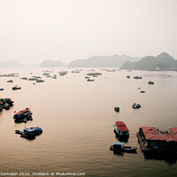 Buy canvas prints of Vietnamese bay with boats plying the sea between mountains and rocks at sunset by Joaquin Corbalan