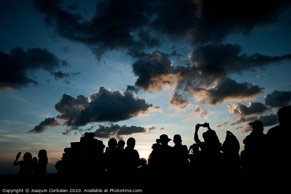 Group of people at sunrise photographing the sun, silhouettes of people Picture Board by Joaquin Corbalan