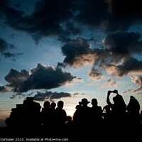 Buy canvas prints of Group of people at sunrise photographing the sun, silhouettes of people by Joaquin Corbalan