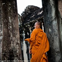Buy canvas prints of Khsach Kandal, Cambodia - 28 October 2011: Tibetan monks in orange robes visiting remote Cambodian temples to meditate. by Joaquin Corbalan