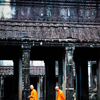 Buy canvas prints of Buddhist monks meditating while walking through the Angkor Thom temple by Joaquin Corbalan