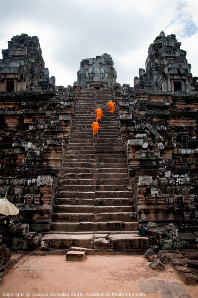 Buddhist monks meditating while walking through the Angkor Thom temple Picture Board by Joaquin Corbalan