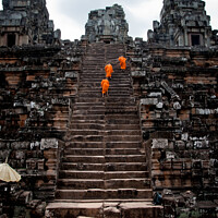 Buy canvas prints of Buddhist monks meditating while walking through the Angkor Thom temple by Joaquin Corbalan
