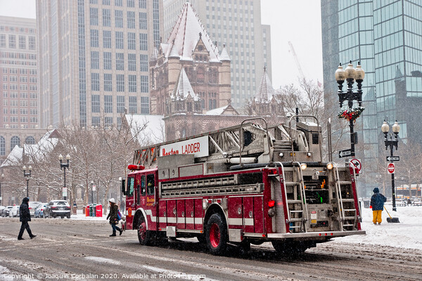 Fire truck traveling the snowy streets of the city. Picture Board by Joaquin Corbalan