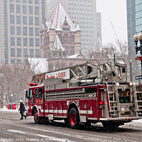 Buy canvas prints of Fire truck traveling the snowy streets of the city. by Joaquin Corbalan