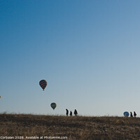 Buy canvas prints of Goreme, Turkey - April 4, 2012: Hot air balloons for tourists flying over rock formations at sunrise in the valley of Cappadocia. by Joaquin Corbalan