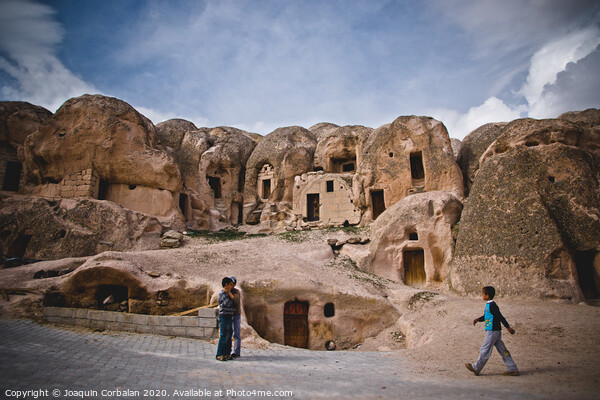 Caves excavated in the rock as dwellings in the city of Cavusin, in the region of Turkish Cappadocia. Picture Board by Joaquin Corbalan