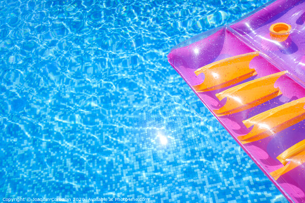 Transparent water from a pool, background with summer colored floats. Picture Board by Joaquin Corbalan