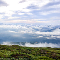 Buy canvas prints of Scene of a winter cloudy sky from the top of a mountain peak. by Joaquin Corbalan