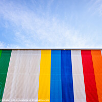 Buy canvas prints of Facade with colored lines, against the blue sky in the background. by Joaquin Corbalan