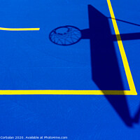 Buy canvas prints of Shadow of a basketball basket on the floor of the court, painted blue and background with lines. by Joaquin Corbalan