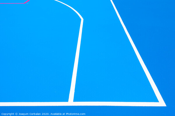 Intense blue background, from the floor of a basketball court to the midday sun, with straight lines and white curves. Picture Board by Joaquin Corbalan