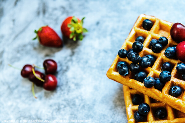 Close-up of a waffle with blueberries and strawberries with delicious aspect, isolated on abstract background with copy space for text. Picture Board by Joaquin Corbalan