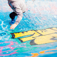 Buy canvas prints of Boy running inside an urban skatepark with sweatshirt having fun, blue tones. by Joaquin Corbalan