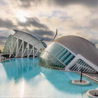 Buy canvas prints of Panoramic cinema in the city of sciences of Valencia, Spain, visited by tourists next to the museum of sciences of the city in the background, at dawn with clouds and sun. by Joaquin Corbalan