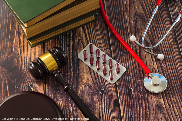Gavel as a symbol of medical justice, applied by doctor judges. Picture Board by Joaquin Corbalan