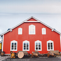 Buy canvas prints of Nice house with red wooden planks in iceland. by Joaquin Corbalan