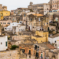 Buy canvas prints of Long panoramic views of the rocky old town of Matera with its stone roofs. by Joaquin Corbalan