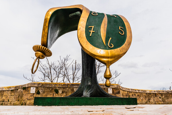 Sculpture Dalí's melted clock displayed on the street on the occasion of the cultural capital of the city. Picture Board by Joaquin Corbalan