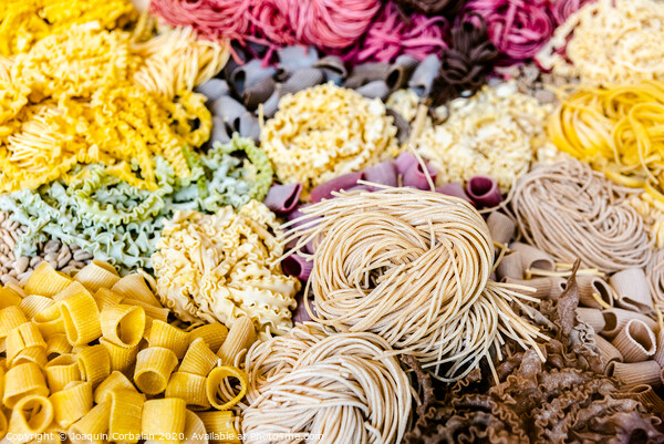 Many types of uncooked Italian pasta of various colors and shapes Picture Board by Joaquin Corbalan