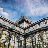Buy canvas prints of Exterior of the Crystal Palace in Madrid, a must for tourists, in the Retiro Park. by Joaquin Corbalan