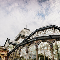 Buy canvas prints of Exterior of the Crystal Palace in Madrid, a must for tourists, in the Retiro Park. by Joaquin Corbalan
