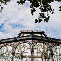 Buy canvas prints of Windows of the glass palace of the Retiro Park in Madrid, with a background of a sky with clouds. by Joaquin Corbalan