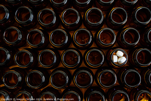 Containers for empty medicines except one full of pills, disease and medicines concept. Picture Board by Joaquin Corbalan