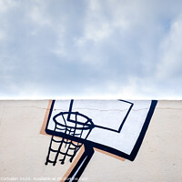 Buy canvas prints of Outdoor basketball court decorated with street graffiti, half with blue sky and clouds in the background. by Joaquin Corbalan