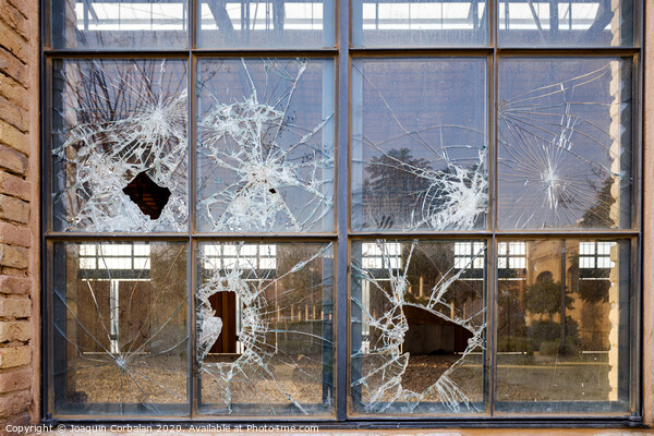 Stoned window with broken glass of an industry. Picture Board by Joaquin Corbalan