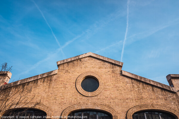 Facade of the old train workshop factories in the Central Park of Valencia. Picture Board by Joaquin Corbalan