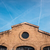 Buy canvas prints of Facade of the old train workshop factories in the Central Park of Valencia. by Joaquin Corbalan