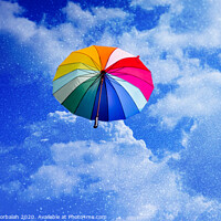 Buy canvas prints of Multicolored umbrella flying suspended over bright blue sky background , with copy space. by Joaquin Corbalan