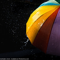 Buy canvas prints of Rain on a warm-toned umbrella lit by the sun, isolated on black background with copy space. by Joaquin Corbalan
