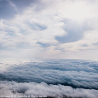 Buy canvas prints of Awesome view on top of the clouds on a cloudy morning. by Joaquin Corbalan