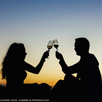 Buy canvas prints of Enamored couple embraced at sunset in a backlit photo by Joaquin Corbalan