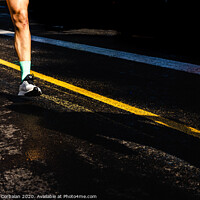 Buy canvas prints of Running athletes have powerful quadriceps and calf muscles for running on asphalt. by Joaquin Corbalan