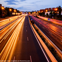 Buy canvas prints of Trails of car lights on a large road at night. by Joaquin Corbalan