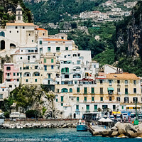 Buy canvas prints of Sorrento, Italy - June 5, 2019: View from the sea of this picturesque Italian Mediterranean city, with old and colorful houses built on the side of a hill. by Joaquin Corbalan