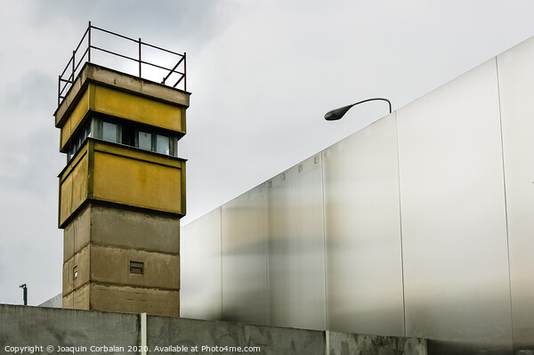 Berlin, Germany - June 6, 2019: Watchtower next to a wall on a border to control illegal immigrants. Picture Board by Joaquin Corbalan