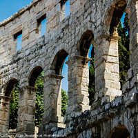 Buy canvas prints of Roman amphitheater in Pula, the best preserved ancient monument in Croatia, visited by hundreds of tourists. by Joaquin Corbalan