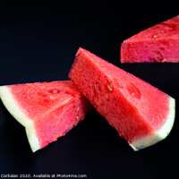 Buy canvas prints of Three slices of watermelon stacked of intense color isolated on black background. by Joaquin Corbalan