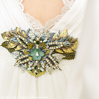 Buy canvas prints of Flower shaped brooch made with small gemstones for a wedding dress. by Joaquin Corbalan