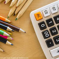 Buy canvas prints of Colored pencils and calculator on a table. by Joaquin Corbalan