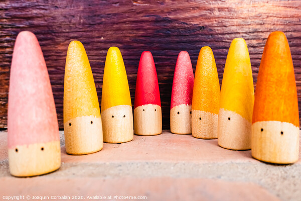 Set of colored wooden conical fish toys for unstructured children's games. Picture Board by Joaquin Corbalan